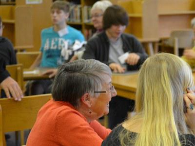 State College Area High School students and older adult volunteers discuss the "Hitler's Daughter" story and issues of war and peace.